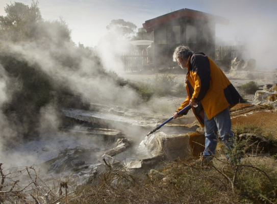 GNS Scientist Brad Scott taking geothermal water samples at Whakarewarewa Village, Rotorua