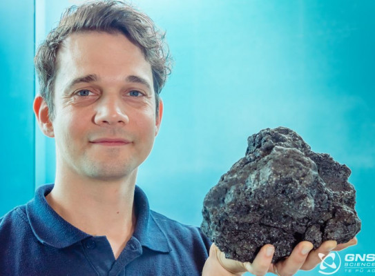 Marine geologist Christian Timm of GNS Science with one of the volcanic rocks collected from the seafloor along the Kermadec Arc.