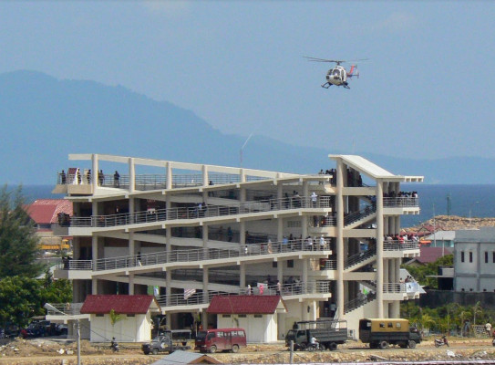 Police helicopter landing on a tsunami vertical evacuation building during Banda Aceh’s first tsunami drill, 2008. Graham Leonard