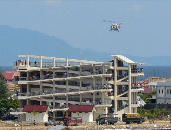 Police helicopter landing on a tsunami vertical evacuation building during Banda Aceh’s first tsunami drill, 2008. Graham Leonard